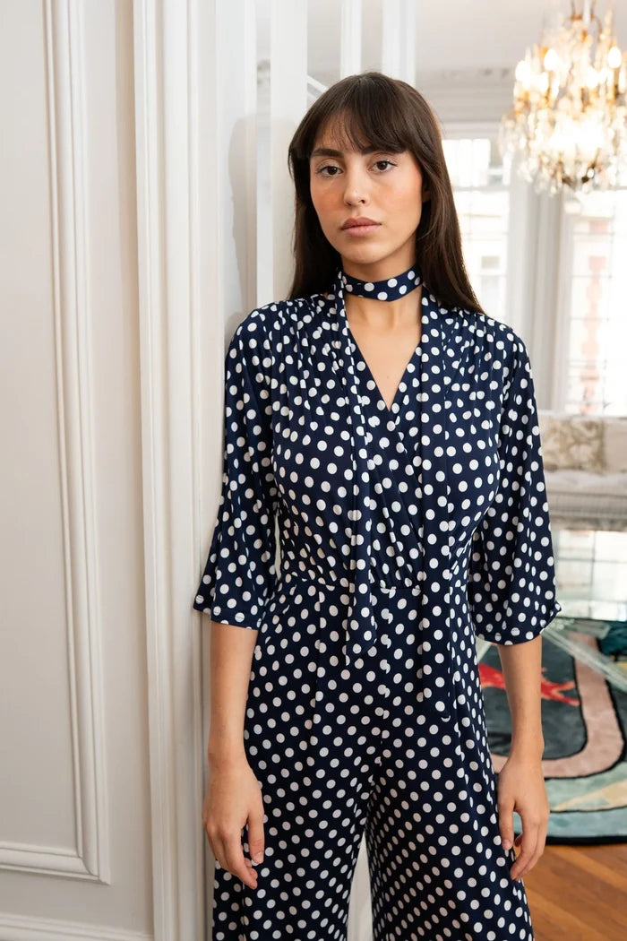 Model wears polka dot jumpsuit