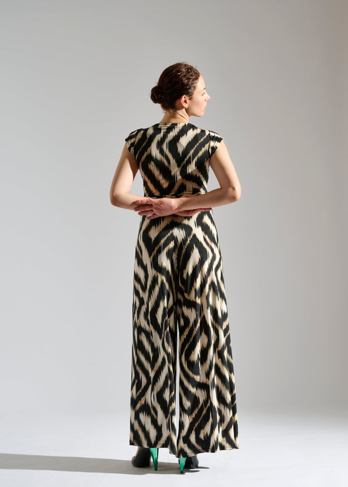 Second back view of Romy sleeveless zebra-patterned jumpsuit.