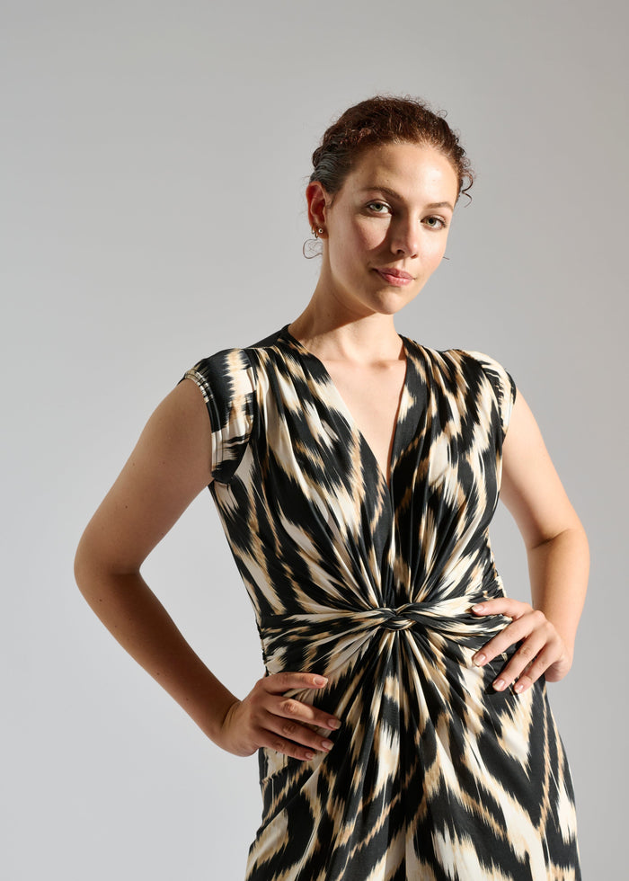 Close up of Romy sleeveless zebra-patterned jumpsuit.