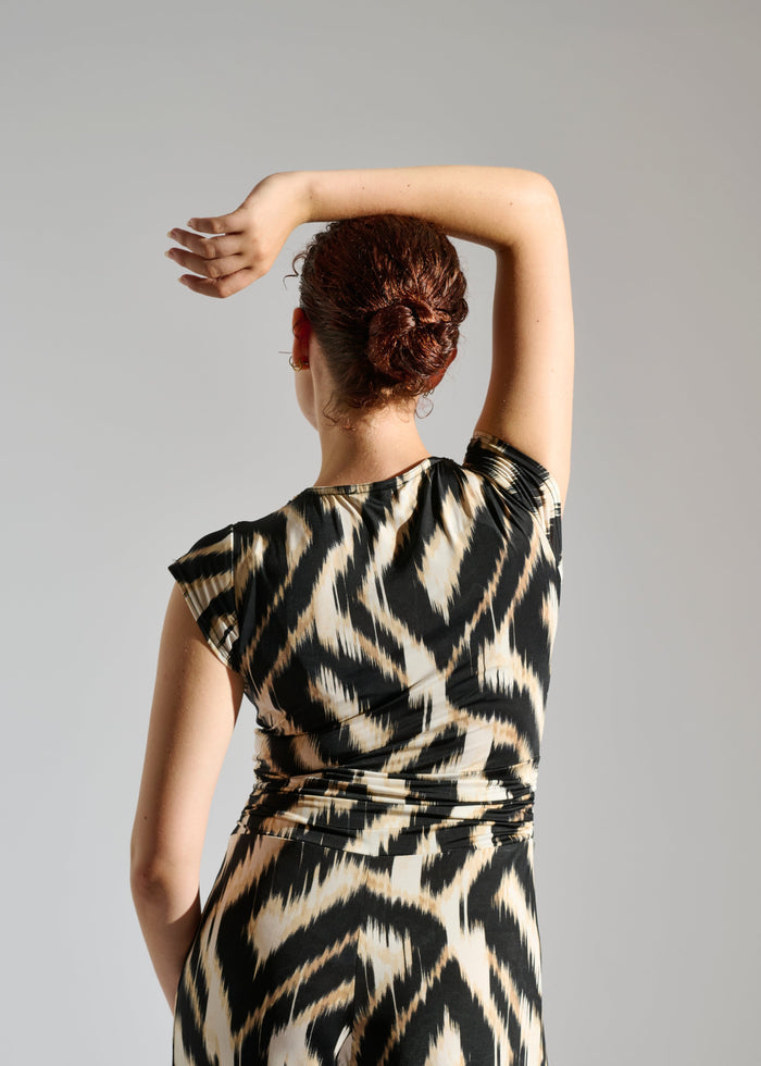 Second Close up of Romy sleeveless zebra-patterned jumpsuit.