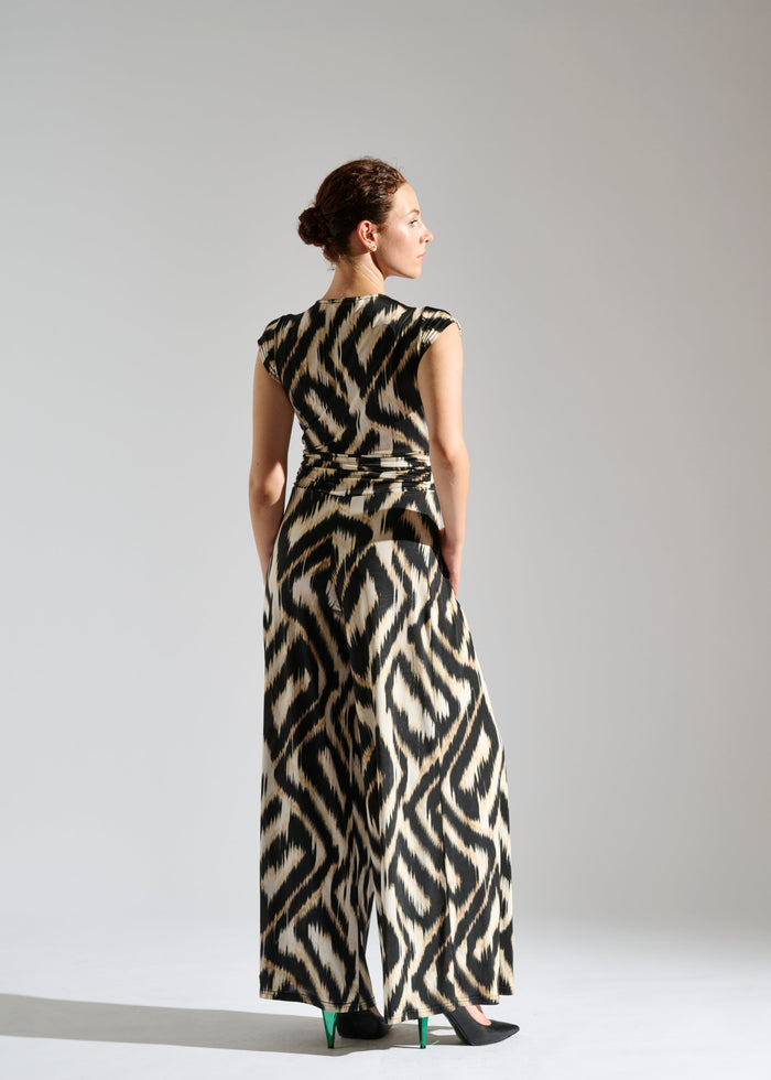 Back view of Romy sleeveless zebra-patterned jumpsuit.