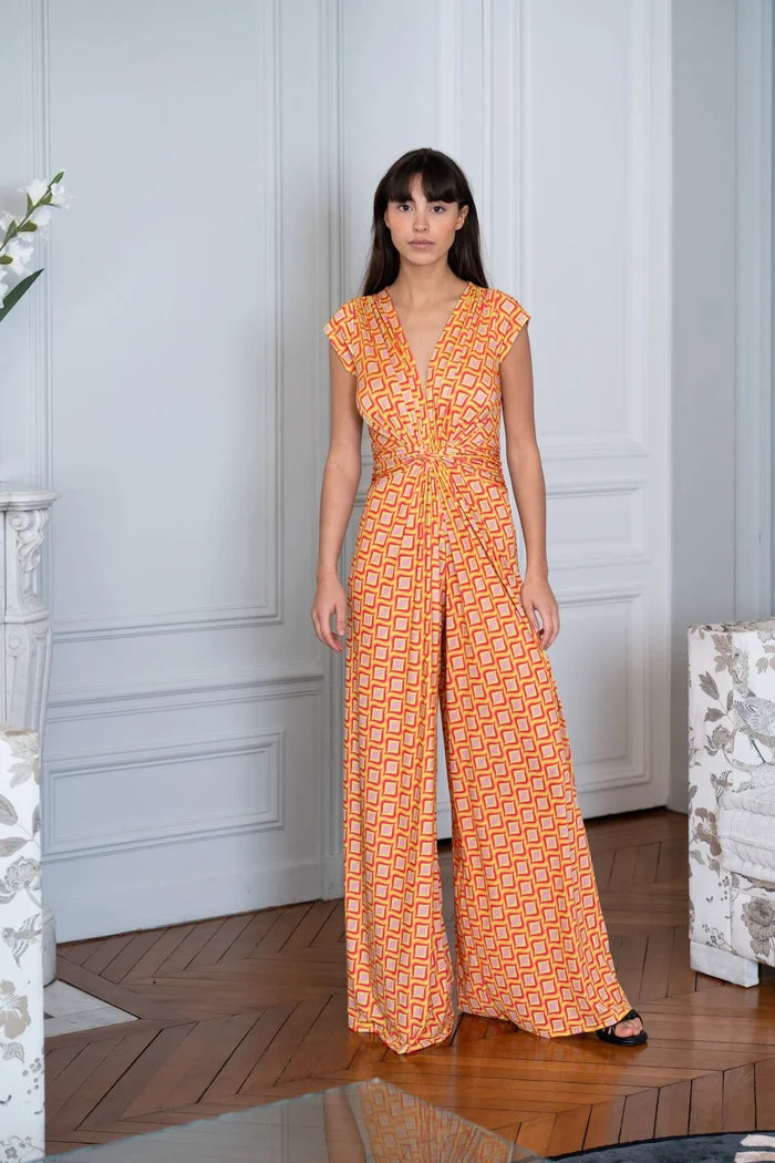 Model wearing an Elegance Miss elegant jumpsuit in a Paris apartment