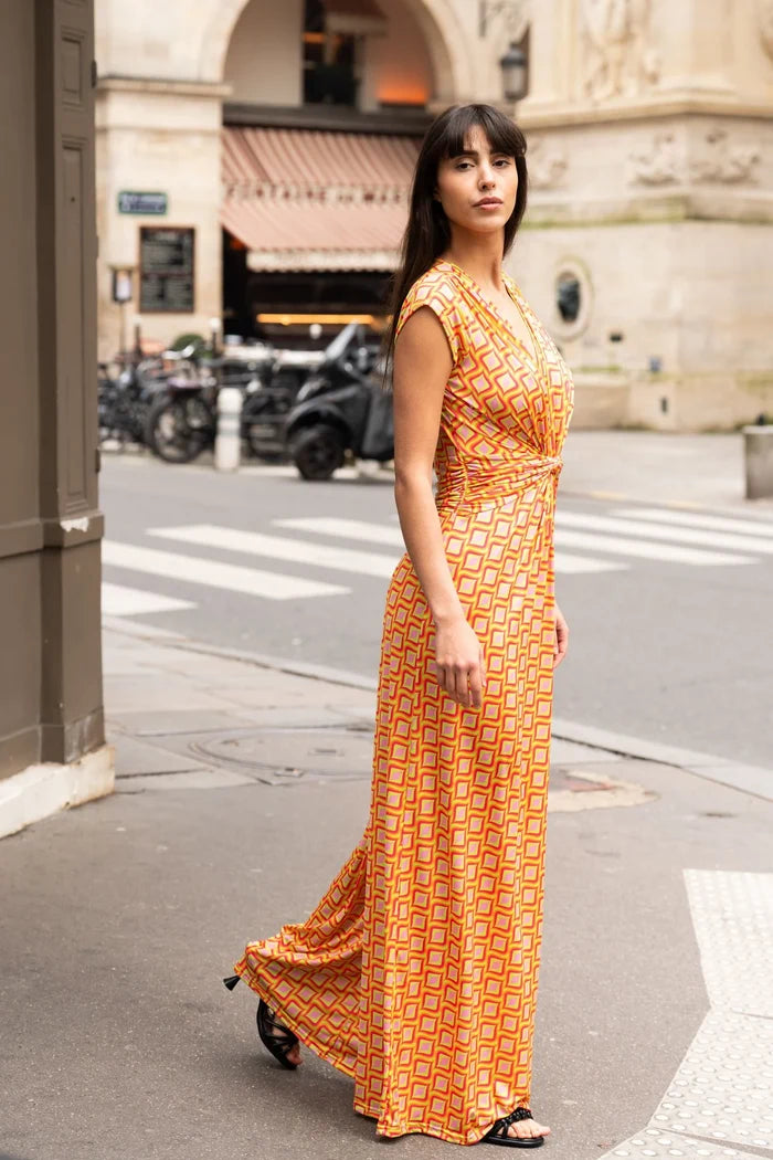 Model dons elegant jumpsuit on a Paris street