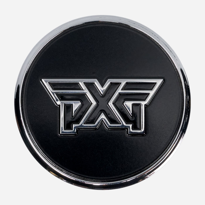 PXG chrome golf ball marker with a black side featuring an "X" with a yellow lightning bolt and a black side featuring a black PXG logo, on a white background