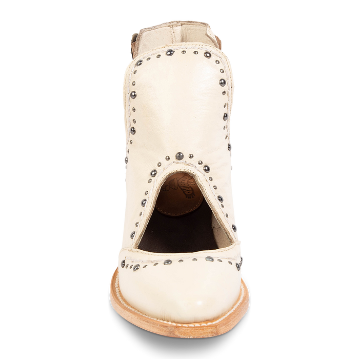 Front view showing instep cutout and silver stud trim detailing on FREEBIRD women's Melody beige leather shoe