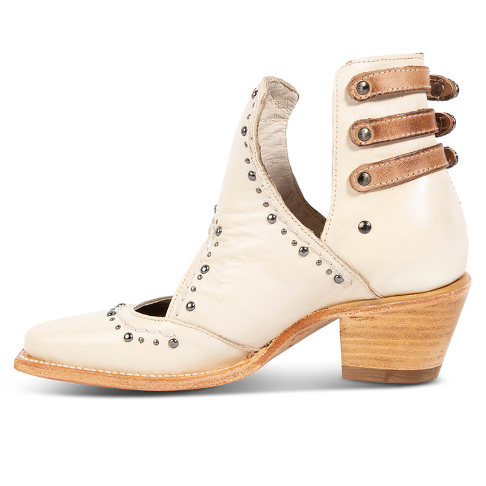 Inside view showing v-cut sides, stud trim detailing, and contrasting heel straps on FREEBIRD women's Melody beige leather shoe