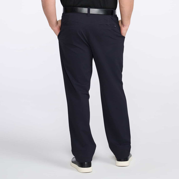 PXG men's navy golf trousers on a white background