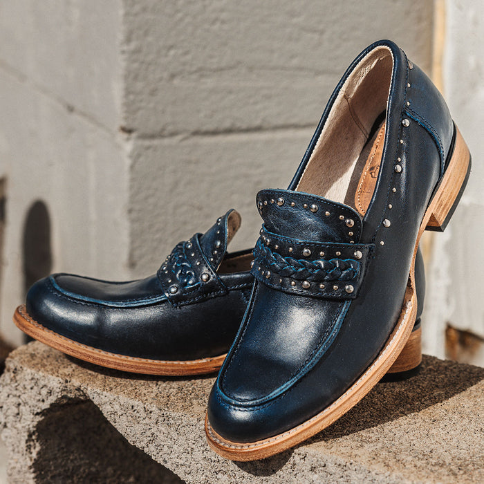 Blue leather MYLA oxford loafer with western-style stud detailing, braided leather band, and a stacked block heel.