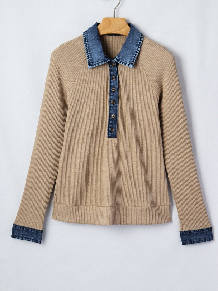 Beige sweater with blue denim collar and cuffs on a white background