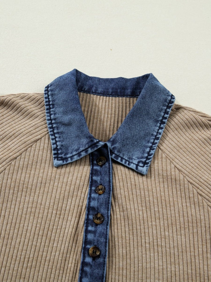 Close-up of a brown ribbed sweater with a blue denim collar and buttons on a beige background
