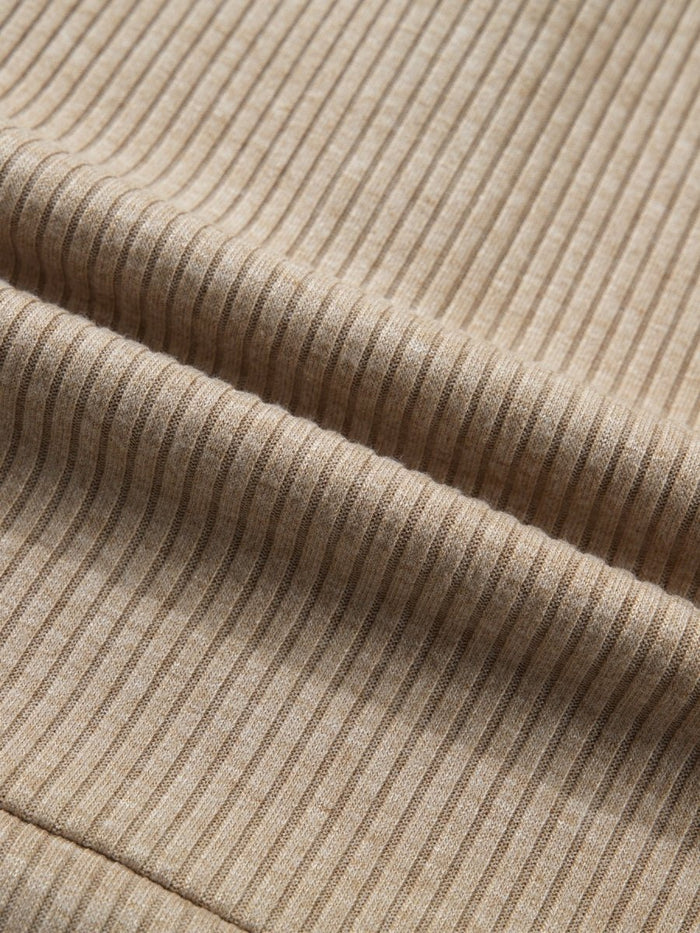 Close-up of beige ribbed fabric texture