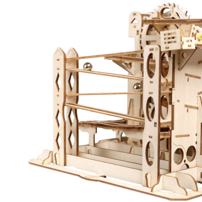 ROKR Marble Explorer wooden 3D puzzle side view showing rail framework and lift wheel mechanism