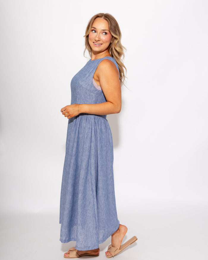 Light blue sleeveless pleated A-line midi dress detail view, boutique dress at Gaudie & Co