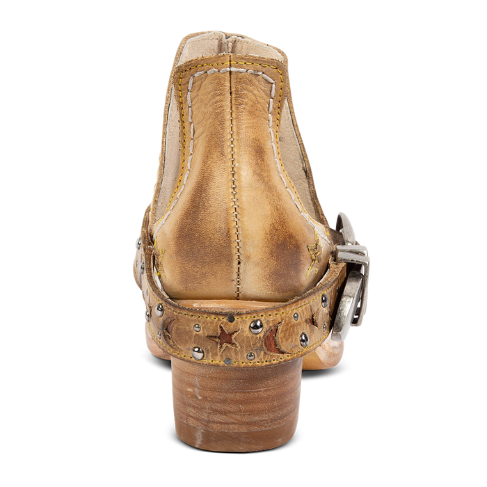 Back view showing a low stacked heel and decorative ankle strap on FREEBIRD women's Stardom beige bootie