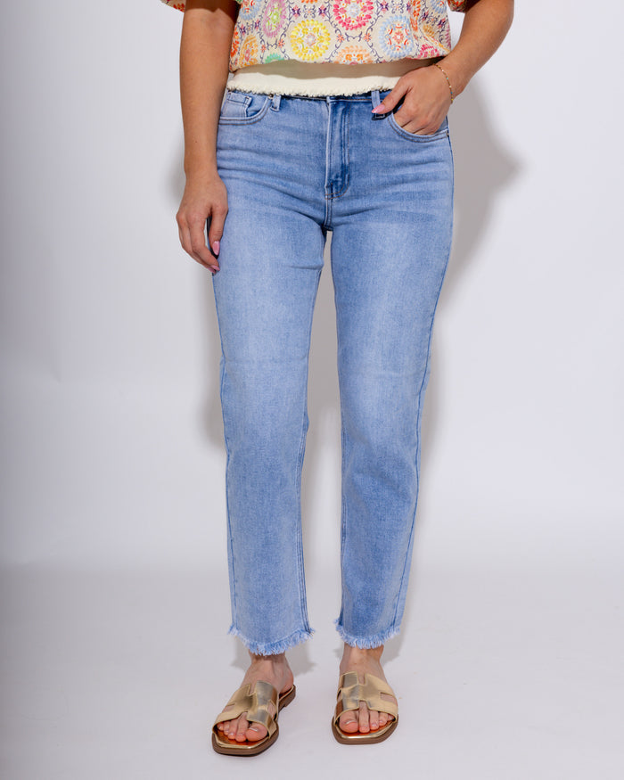Mid-rise straight leg light wash denim jeans with fray hem detail, women's boutique denim at Gaudie & Co