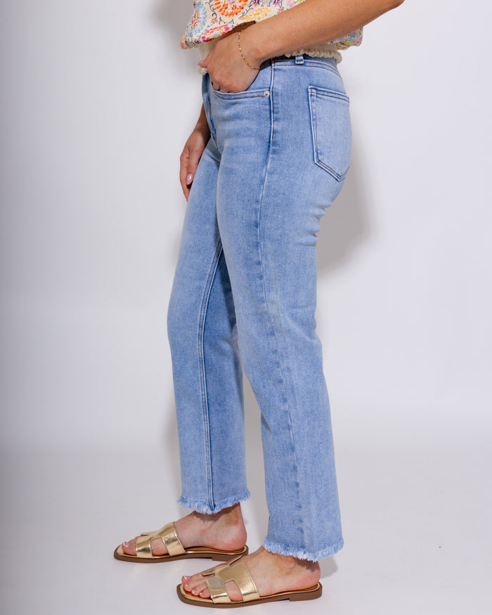 Mid-rise straight leg light wash denim jeans with fray hem detail, women's boutique denim at Gaudie & Co