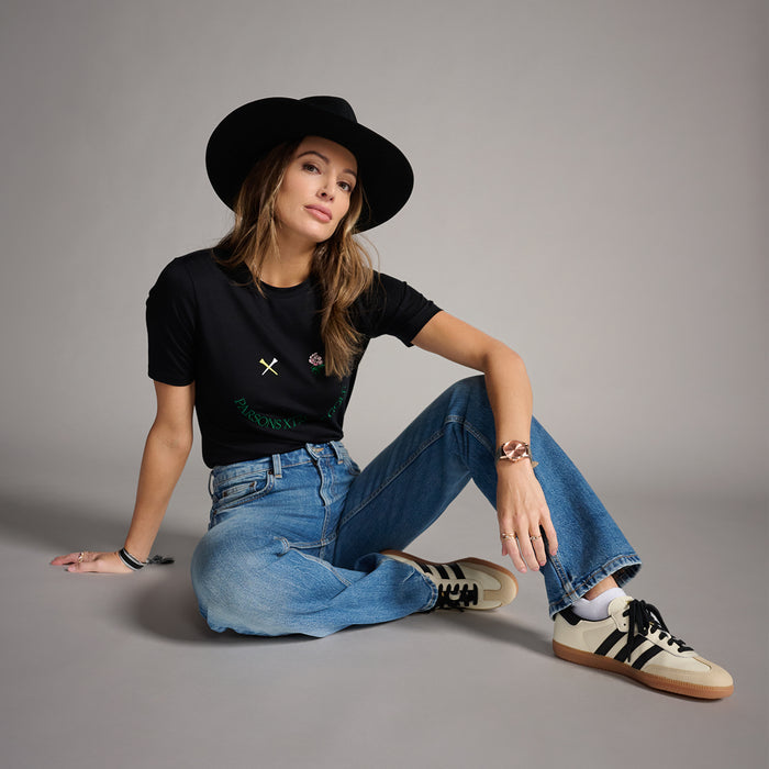Women's Putt On A Happy Face Tee in Black, side seated view