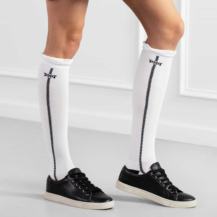 PXG women's white ruffle knee golf socks with ruffles at the top and a black PXG logo on a white background